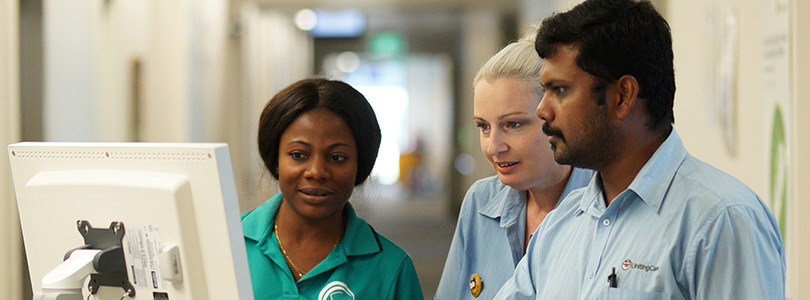St Stephens Hospital staff viewing monitor together